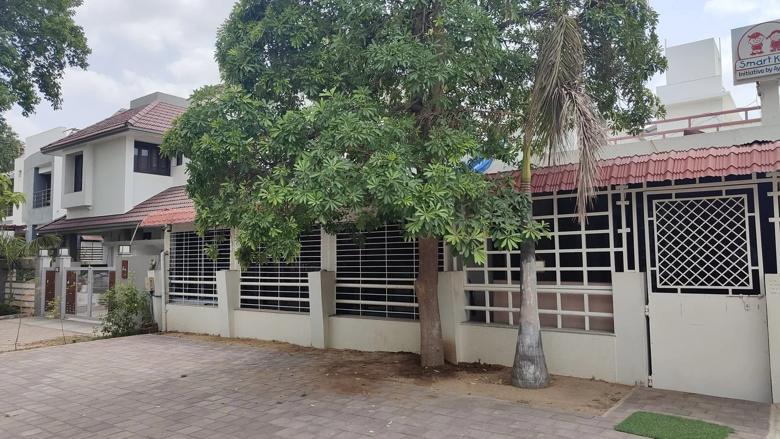 Tree-shaded green space around the campus
